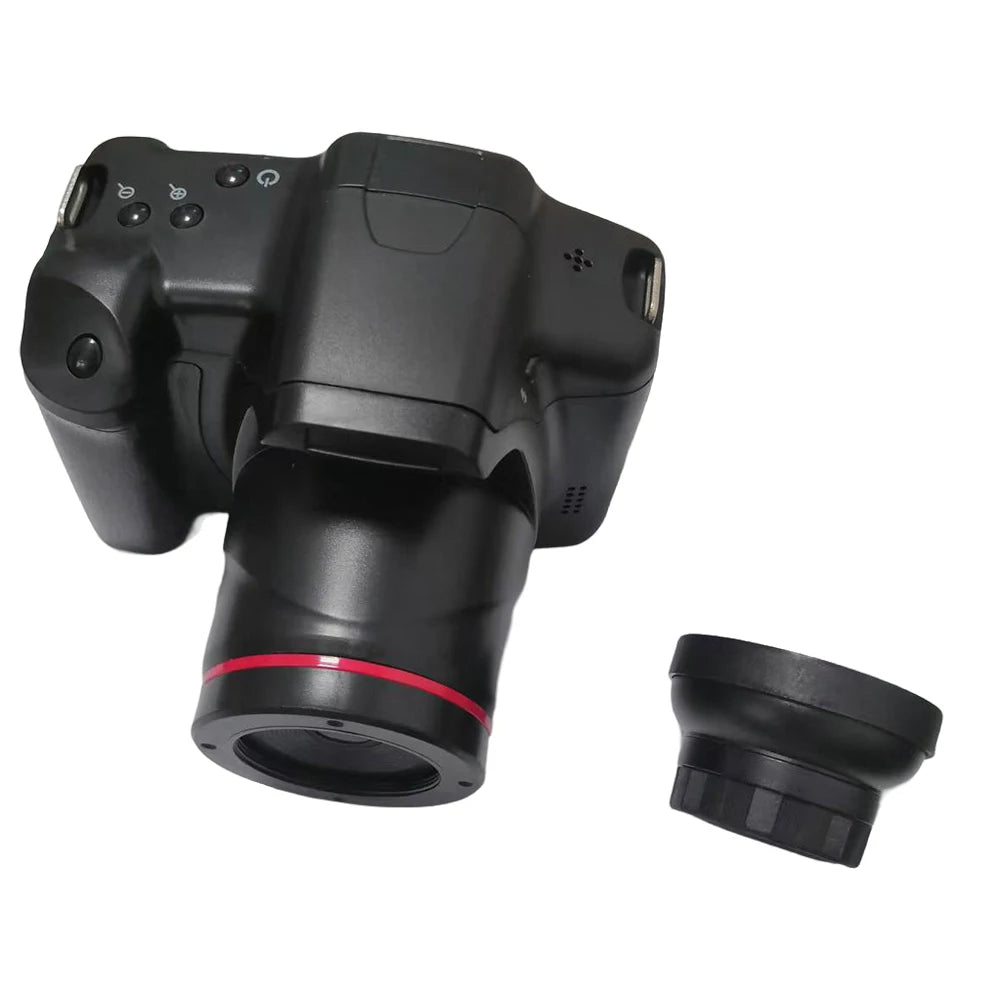 Black plastic digital camera with a red-accented lens and a separate black screw-on lens cap.