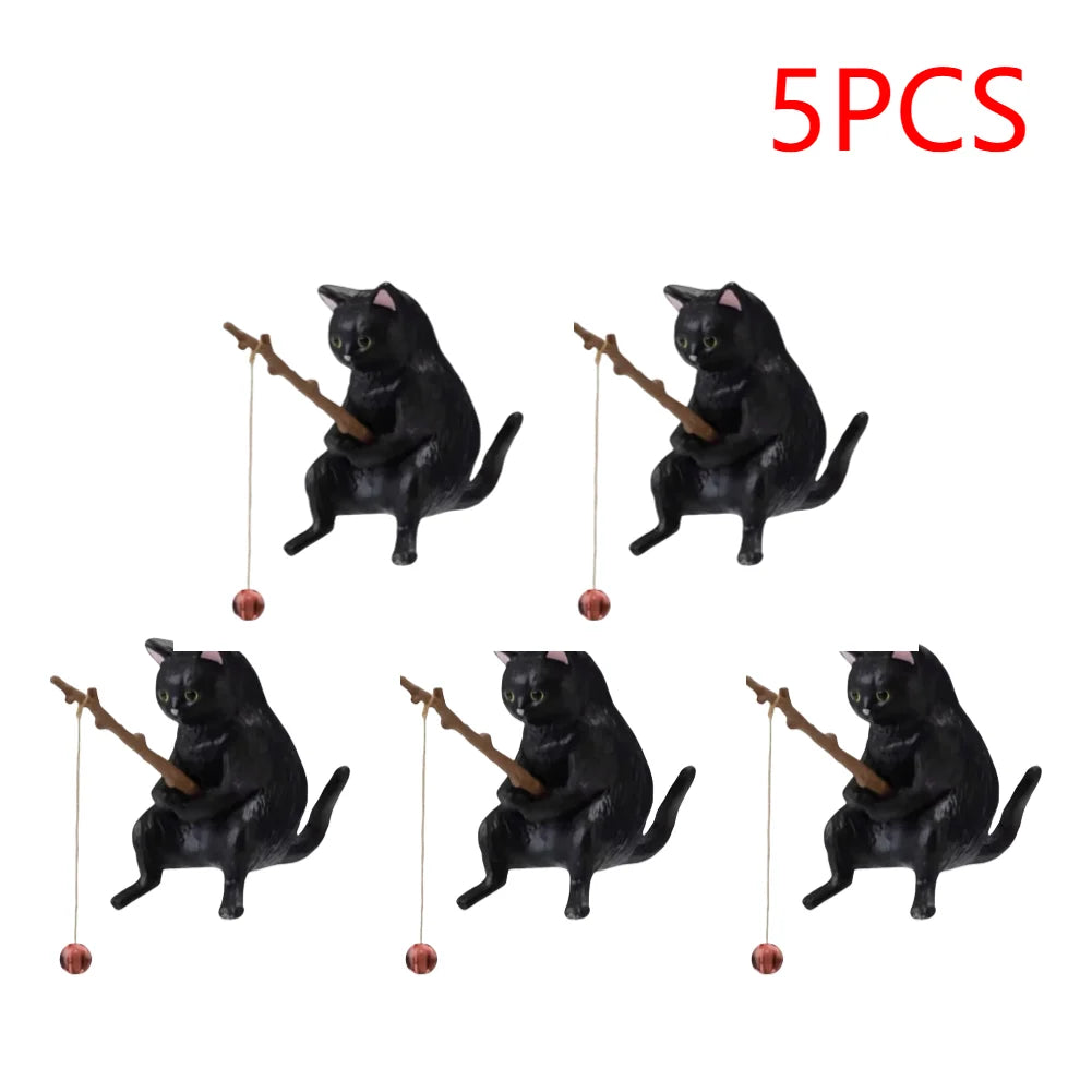Set of five cute black cat aquarium ornaments, each holding a brown fishing rod with a hanging bauble.