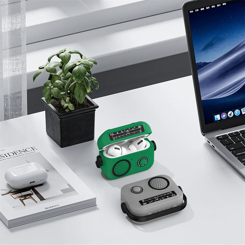 Green and grey silicone AirPods Pro cases designed like retro vintage radios on a desk.