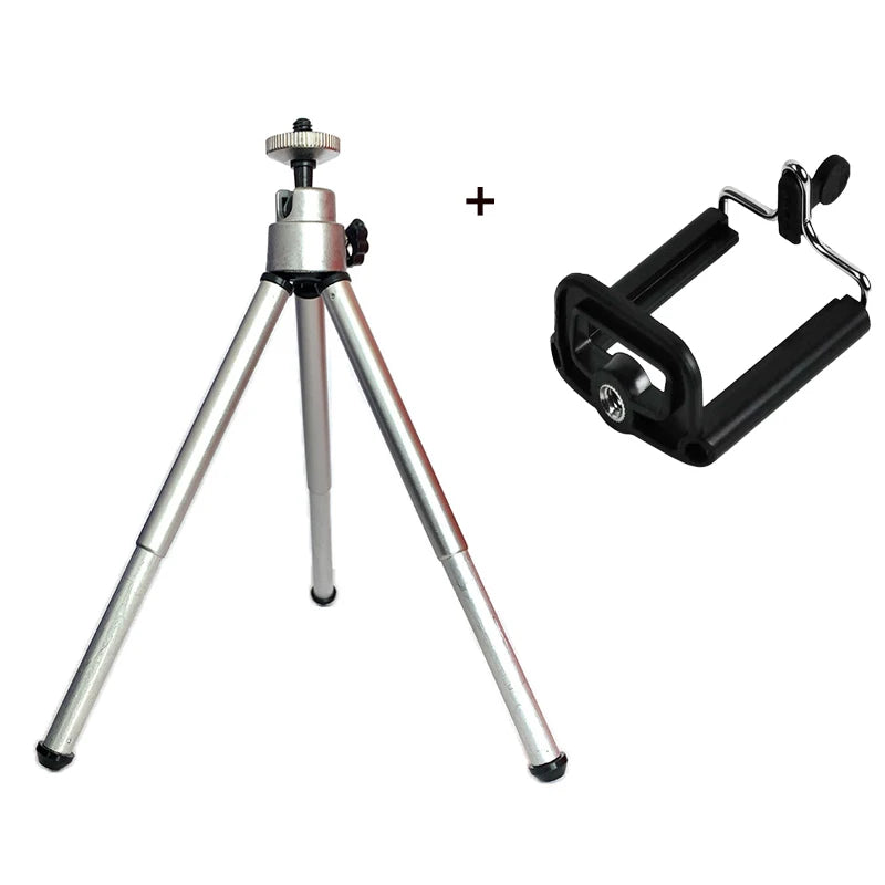 Silver mini tripod stand with an adjustable head, shown alongside a black universal smartphone mount holder.