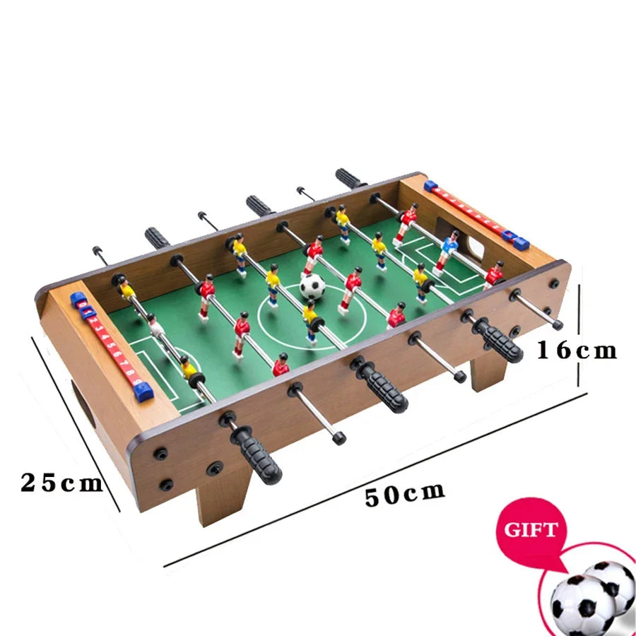 Compact wooden-style tabletop foosball game with colourful players, score sliders, and two mini footballs included.