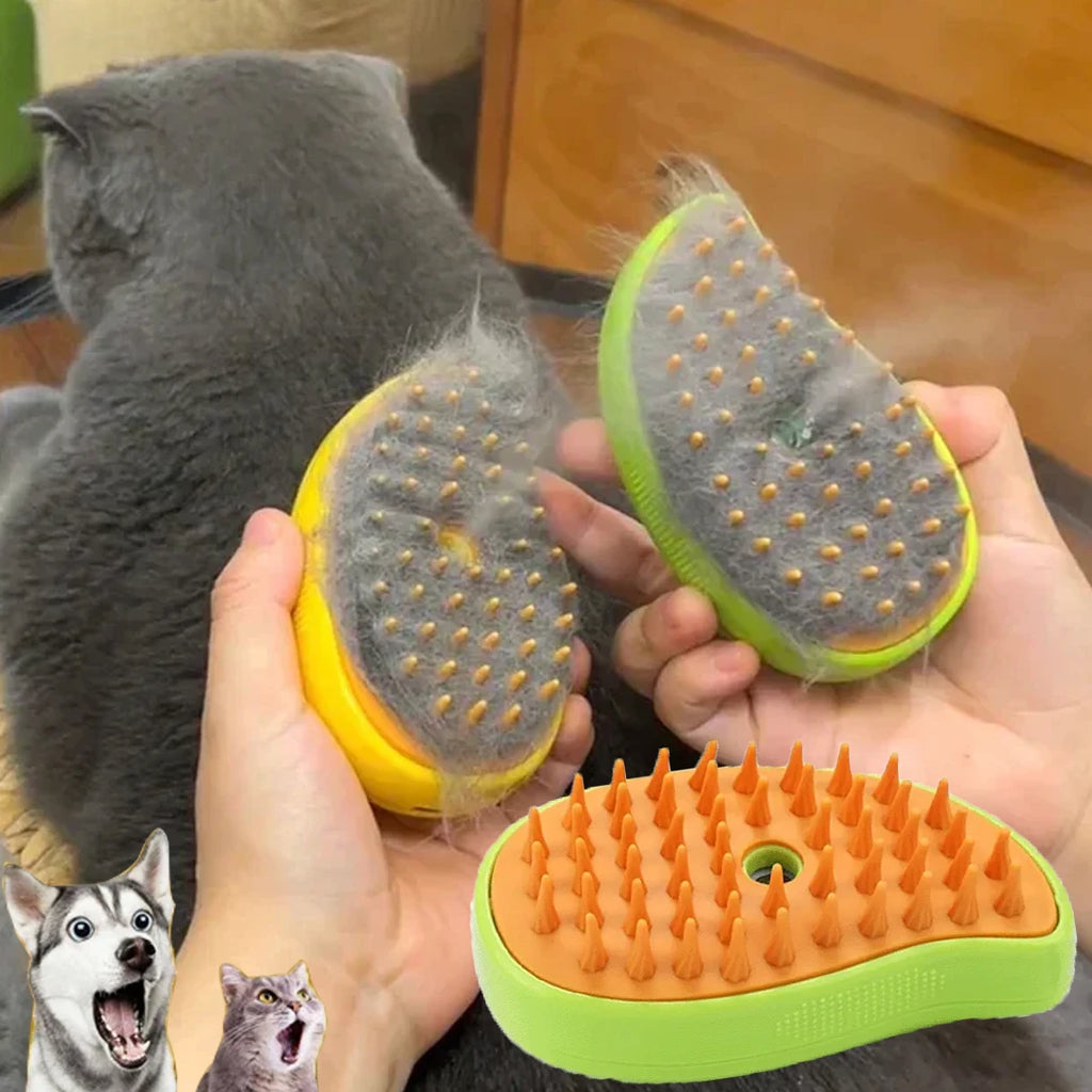 Hands holding a yellow and green steamy pet brush with silicone bristles, shown collecting loose fur from a grey cat.