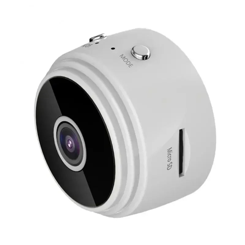 Small white plastic spherical security camera with a black lens, side micro SD card slot, and top mode button.