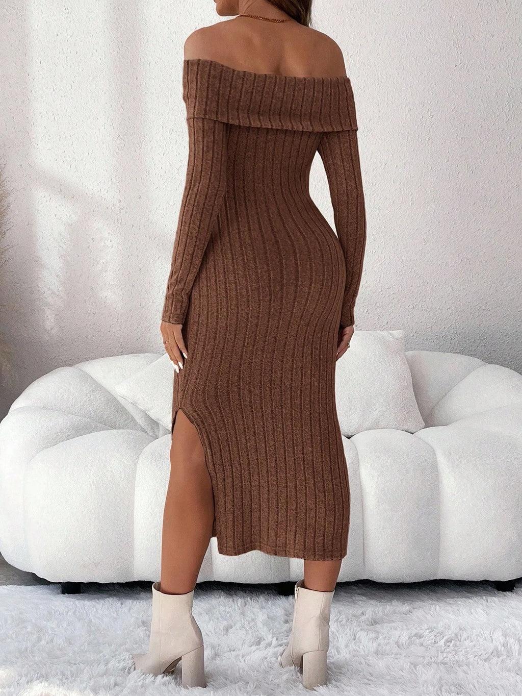 Brown ribbed knit midi dress with off-the-shoulder neckline, long sleeves, and a side leg slit.