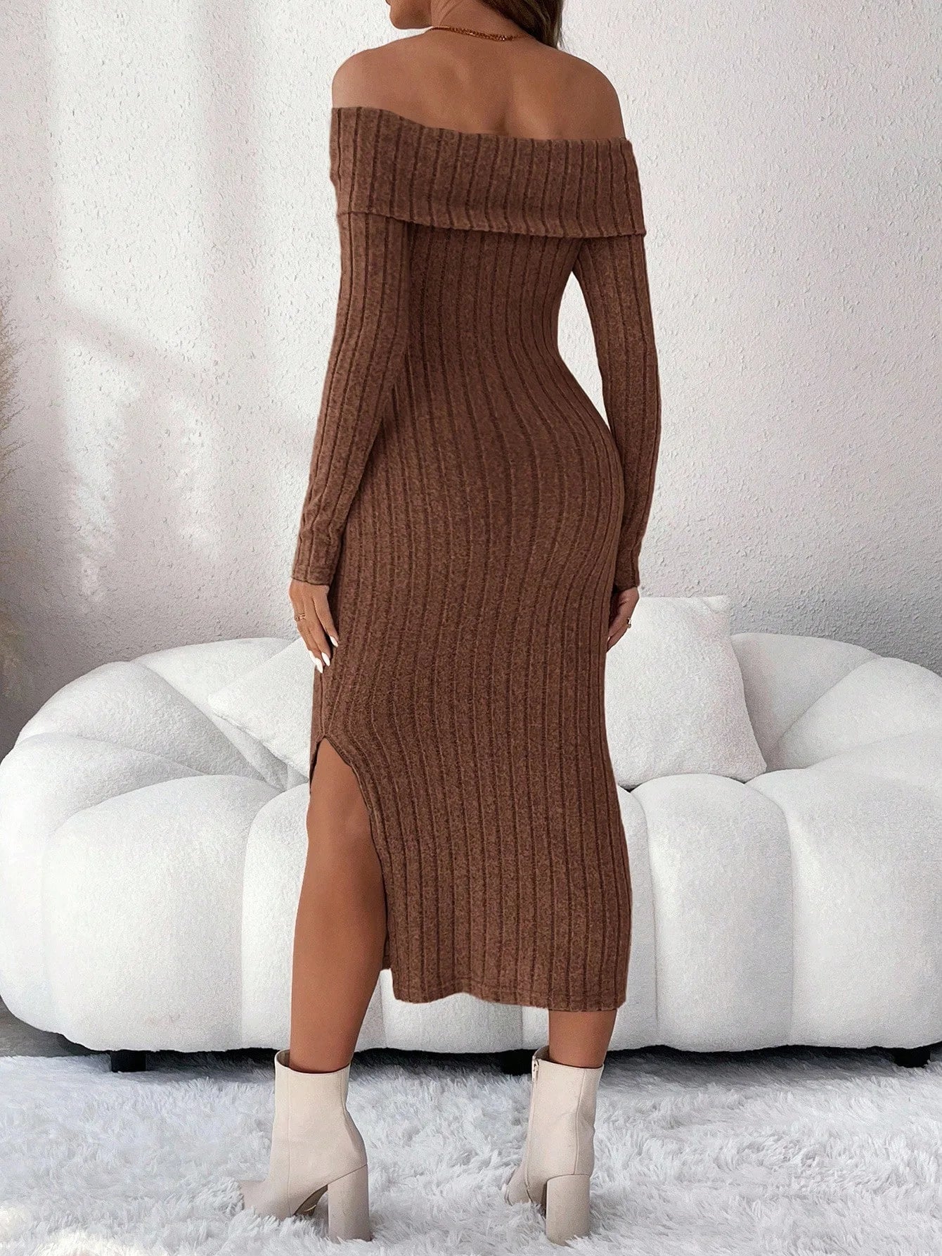 Brown ribbed knit midi dress with off-the-shoulder neckline, long sleeves, and a side leg slit.
