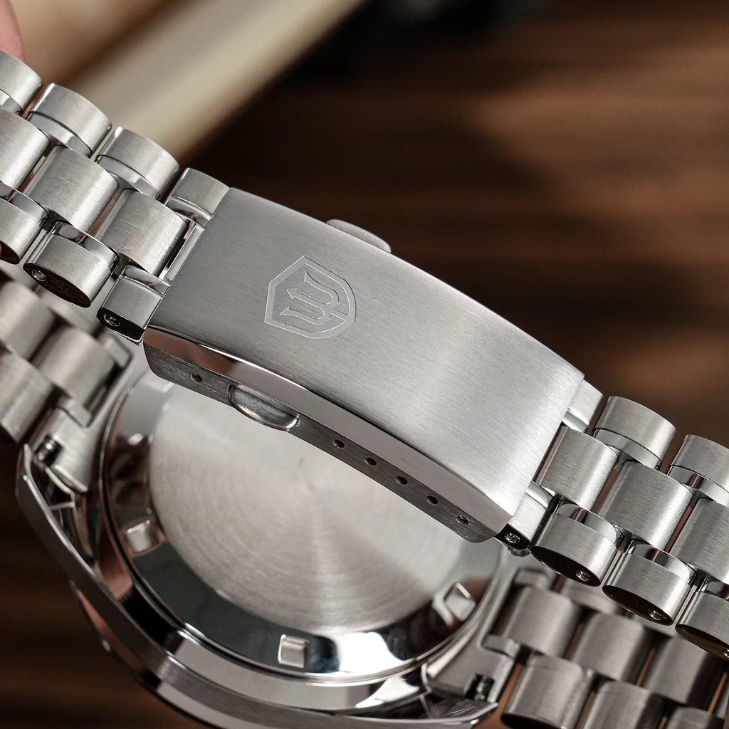 Stainless steel Watchdives WD1860 watch showing the engraved clasp and linked metal bracelet.