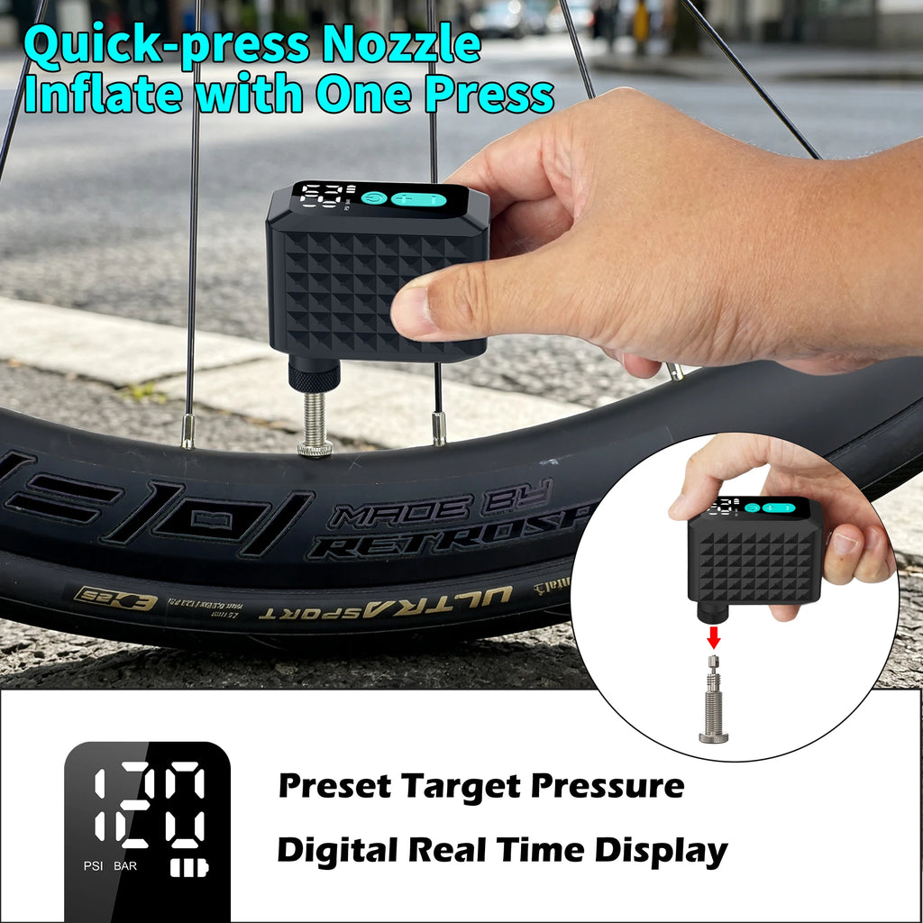 Compact black electric bike pump with digital gauge attached to a bicycle tire valve.
