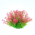 Artificial aquarium plant with bright pink-tipped leaves transitioning to green at the base, isolated on white.
