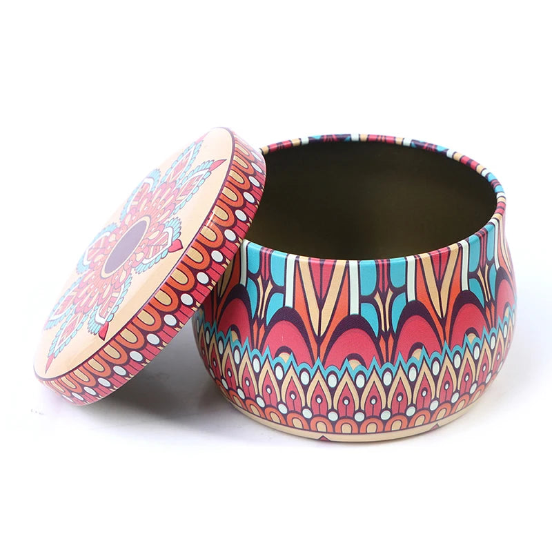 Round metal storage tin featuring a colourful, intricate mandala-style pattern with a matching removable lid.