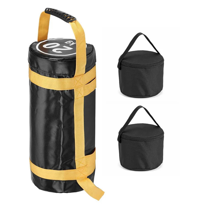 Black cylindrical power training sandbag with yellow straps and handle, shown with two small inner filler bags.