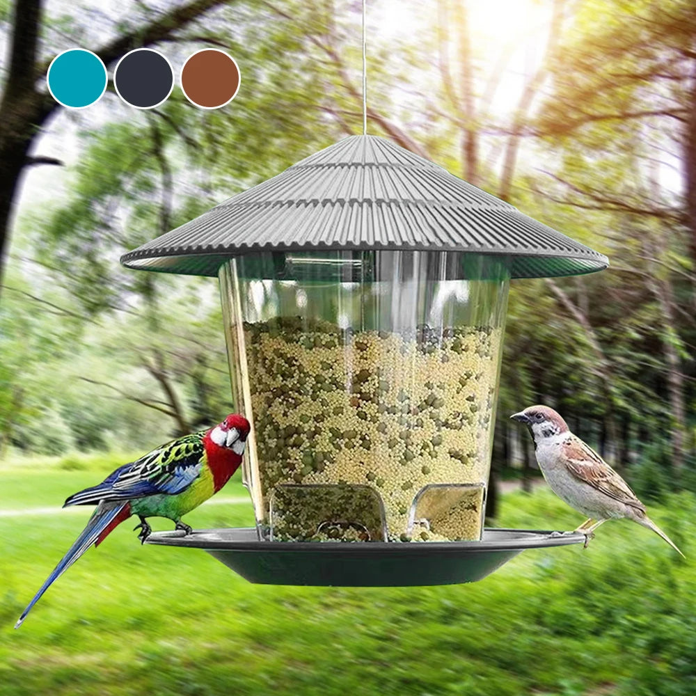 Hanging bird feeder with clear container, grey roof, and wide base. Available in turquoise, grey, and brown color options.