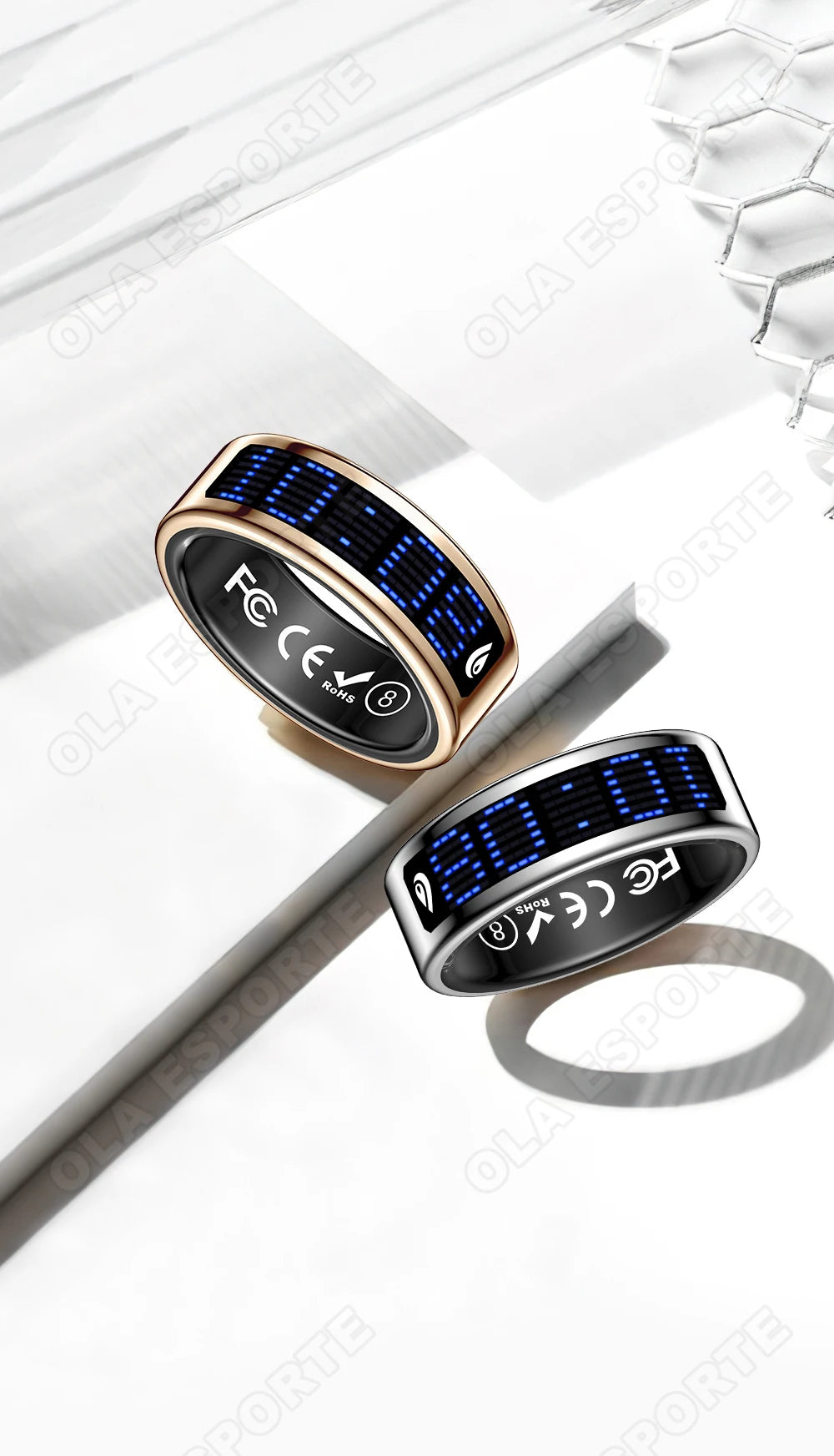 Two smart rings in gold and silver, featuring sleek black bands with glowing blue digital touch displays.