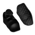 Black ergonomic hairbrush with a curved handle and a separate textured base with oval grid patterns.