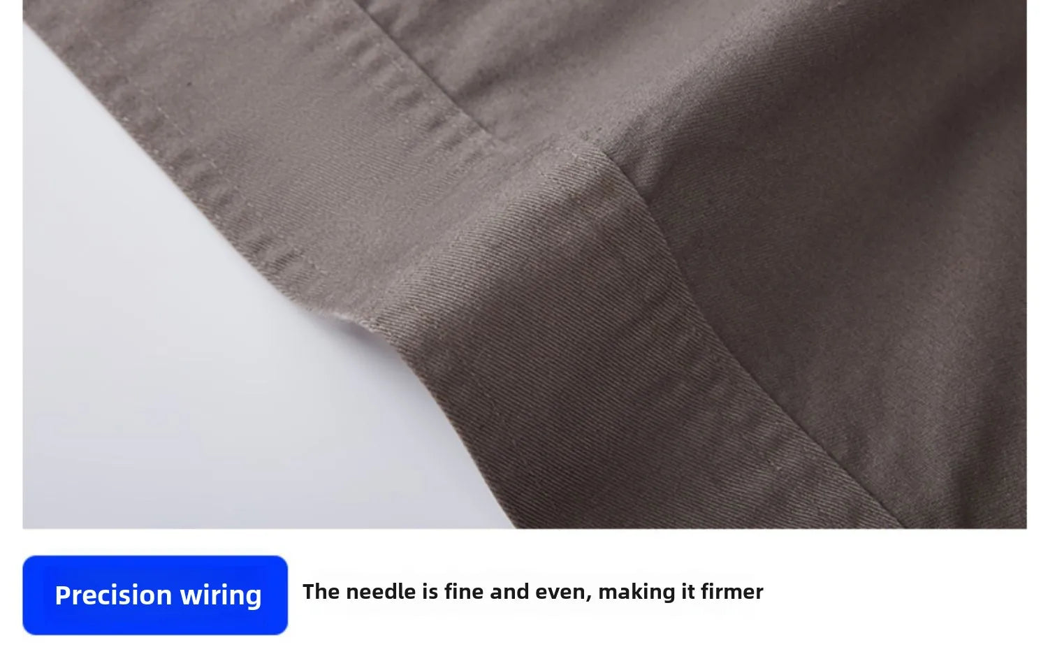 Close-up of brown cotton fabric showing a folded hem with even, reinforced stitched seams.