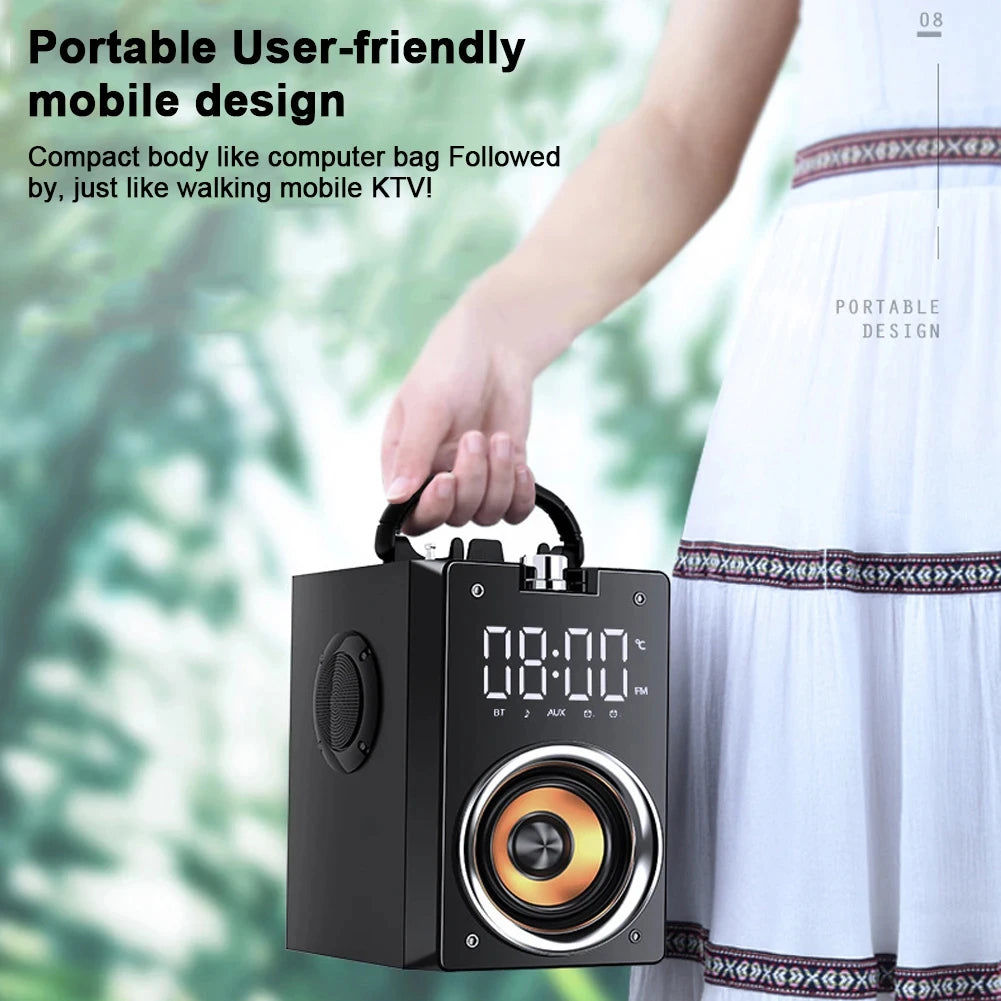 A black, portable Bluetooth speaker with a top handle, digital clock display, and a large front-facing speaker driver.