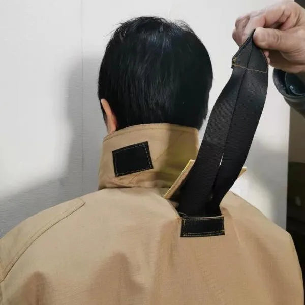 Tan nylon jacket with a back collar featuring a hidden black nylon rescue drag strap.
