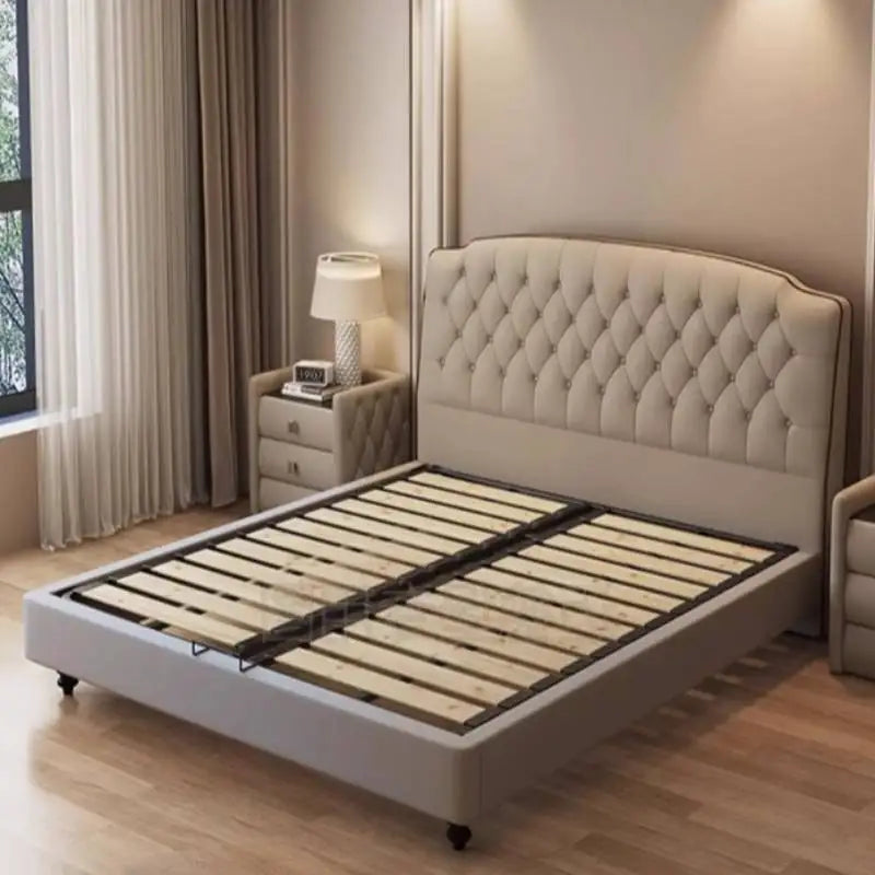 Modern cream-coloured upholstered queen bed frame with a luxurious button-tufted headboard and wooden slatted base.