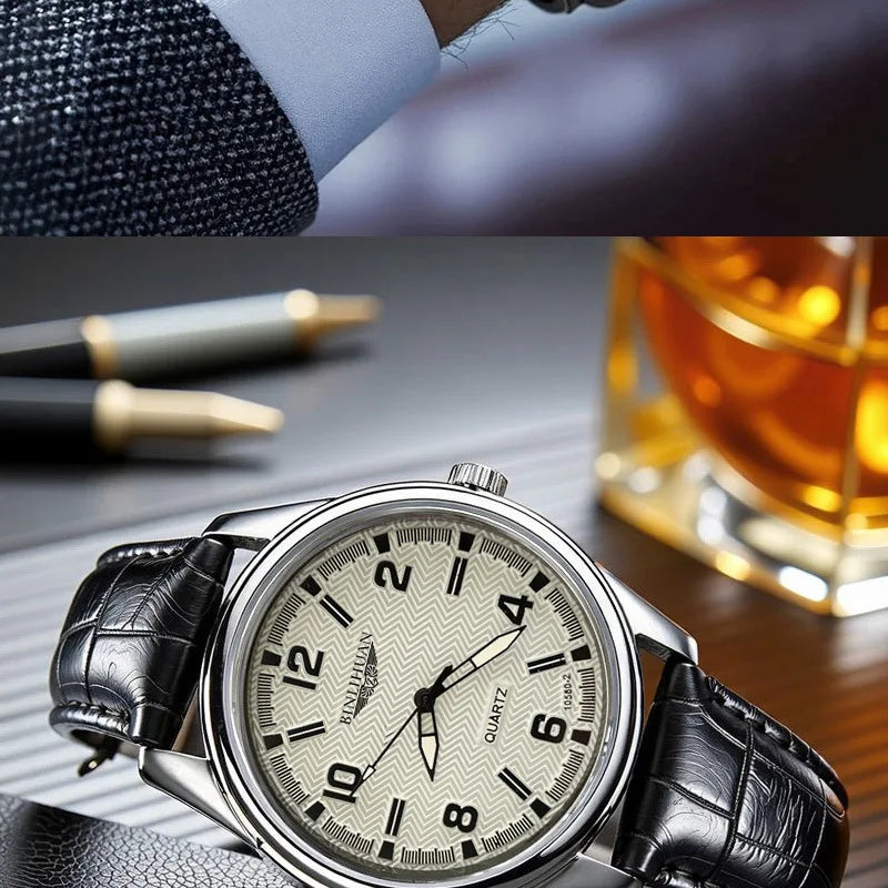 Classic men’s quartz watch with a cream chevron-pattern dial, silver case, and black textured leather strap.