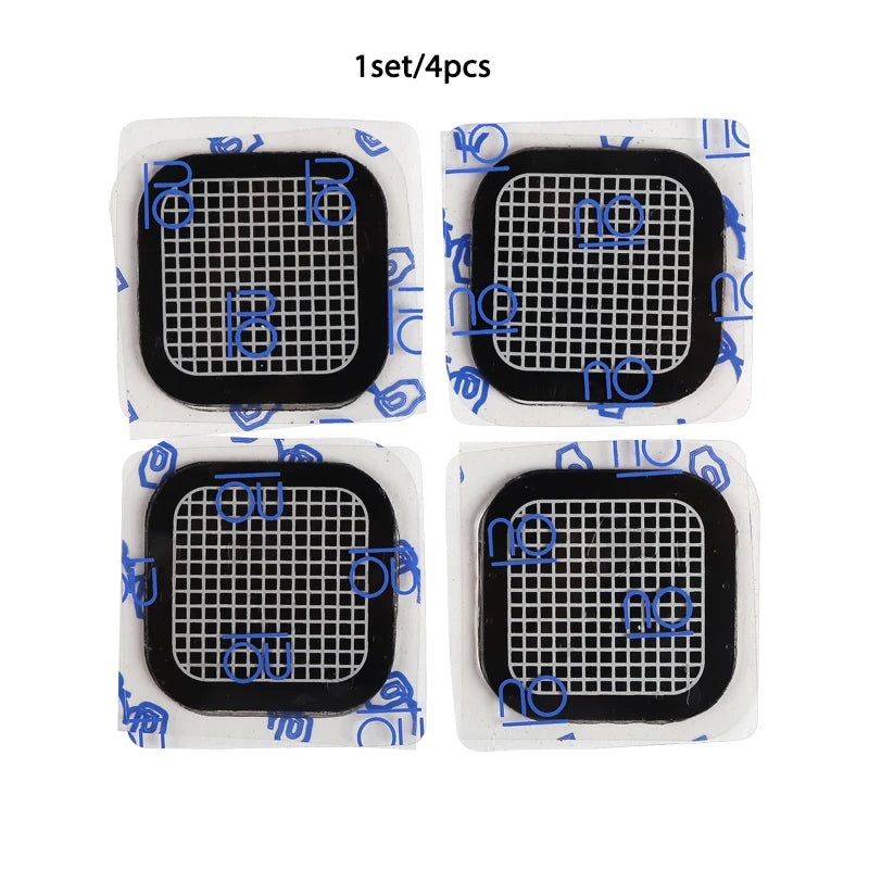 Set of four square, black adhesive gel pads for an abdominal muscle stimulator, featuring a white grid pattern.