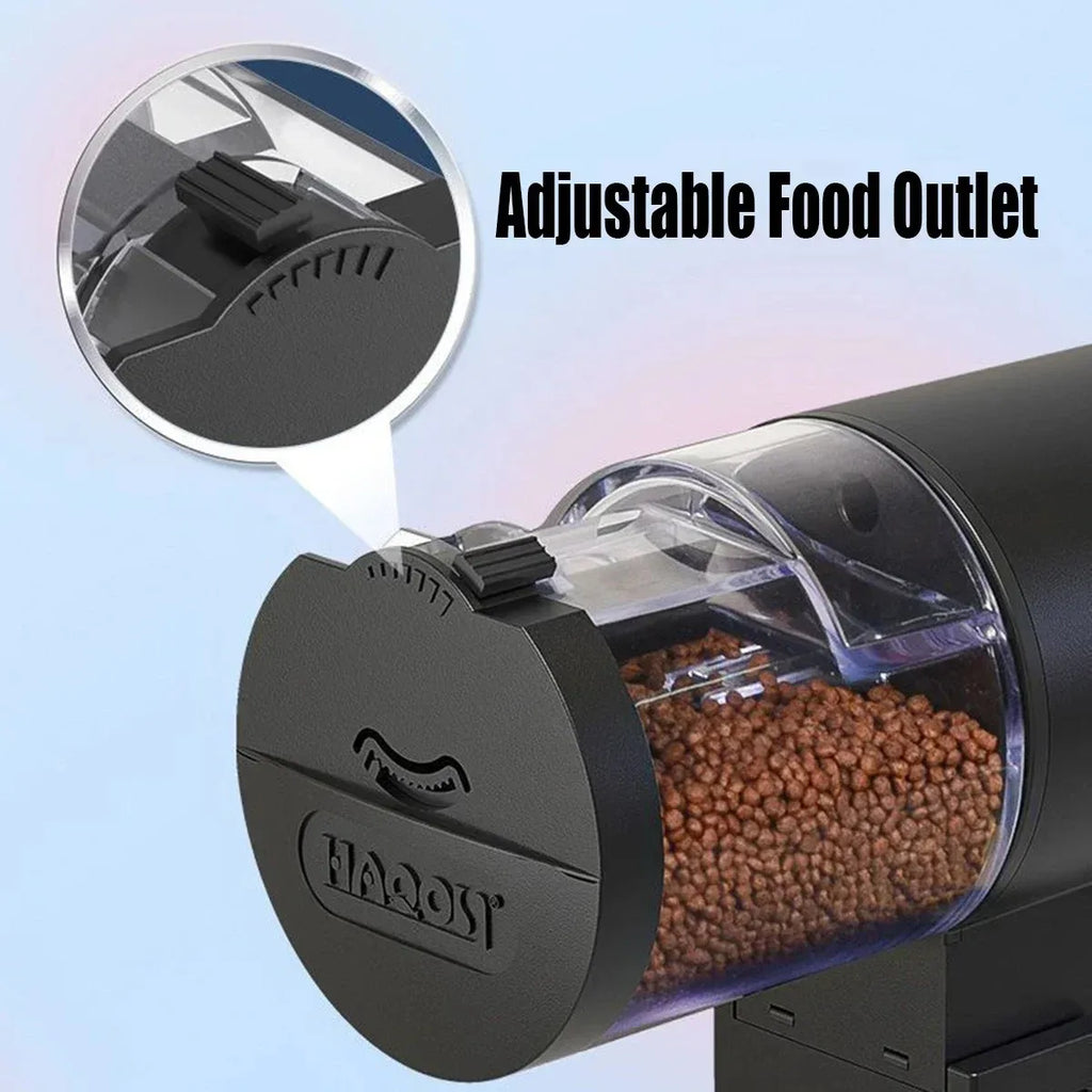 Matte black automatic pet food dispenser with clear hopper showing kibble and an adjustable black food outlet dial.
