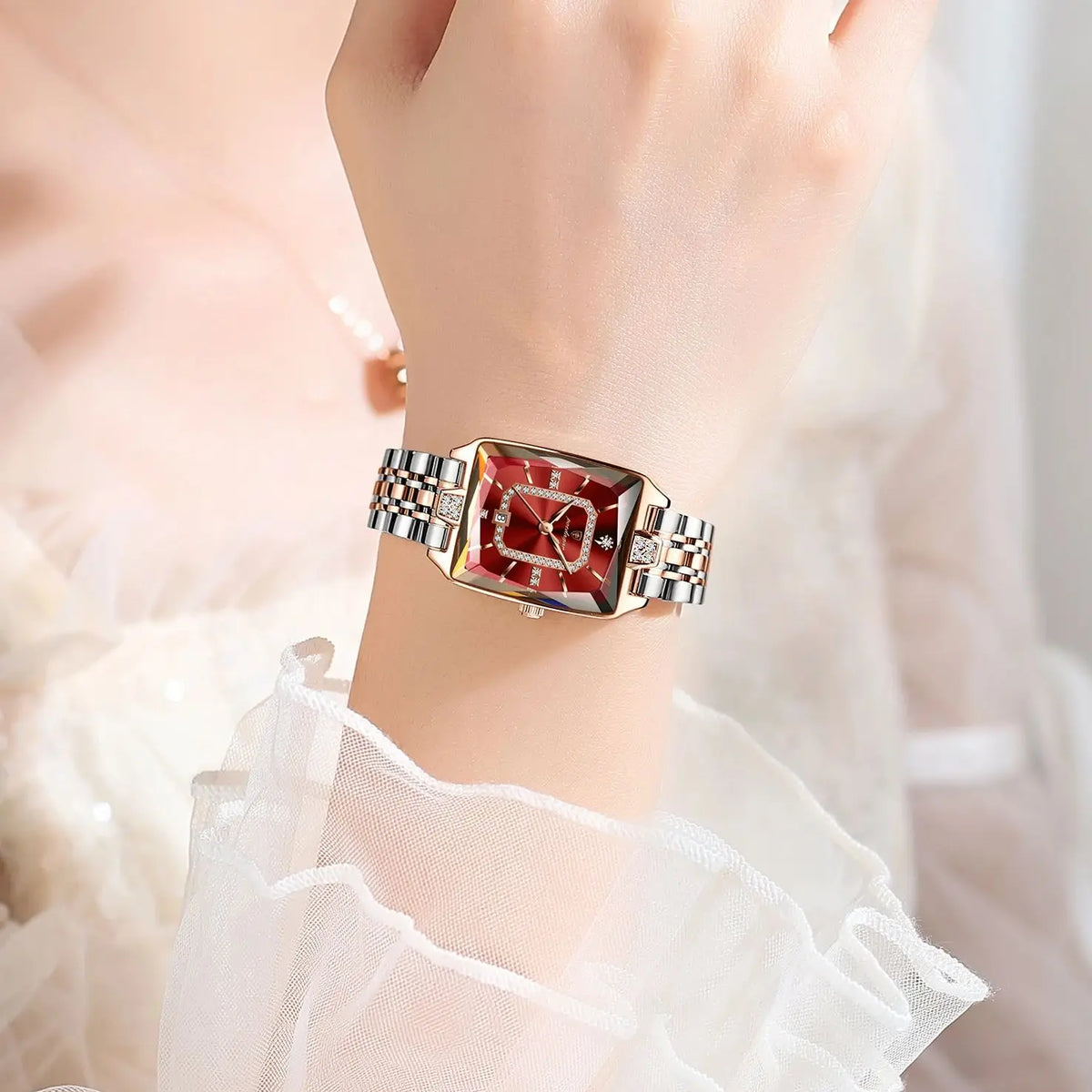 POEDAGAR rectangular quartz watch with red dial, crystal accents, and silver and rose gold metal band.