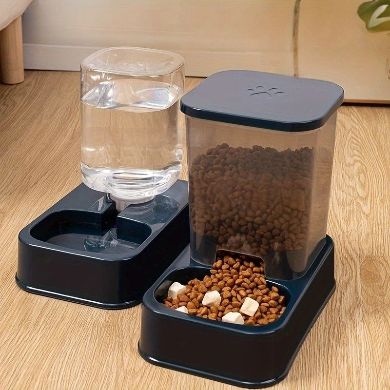Dark blue pet water and food dispenser set with transparent containers for dry food and water on a wooden floor.