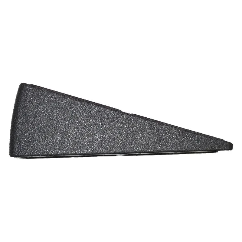 A black, textured door wedge with a triangular, tapered shape on a white background.