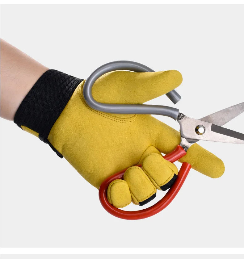 Yellow cowhide leather work gloves with a black elasticated cuff, being worn while holding metal gardening shears.