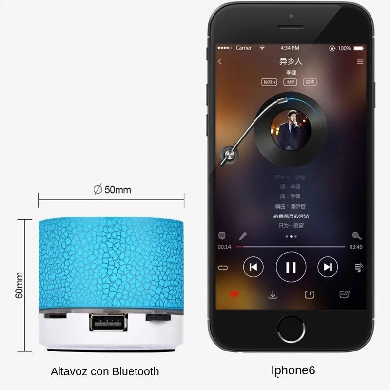 A compact, blue textured wireless speaker next to a smartphone showing a music player interface.