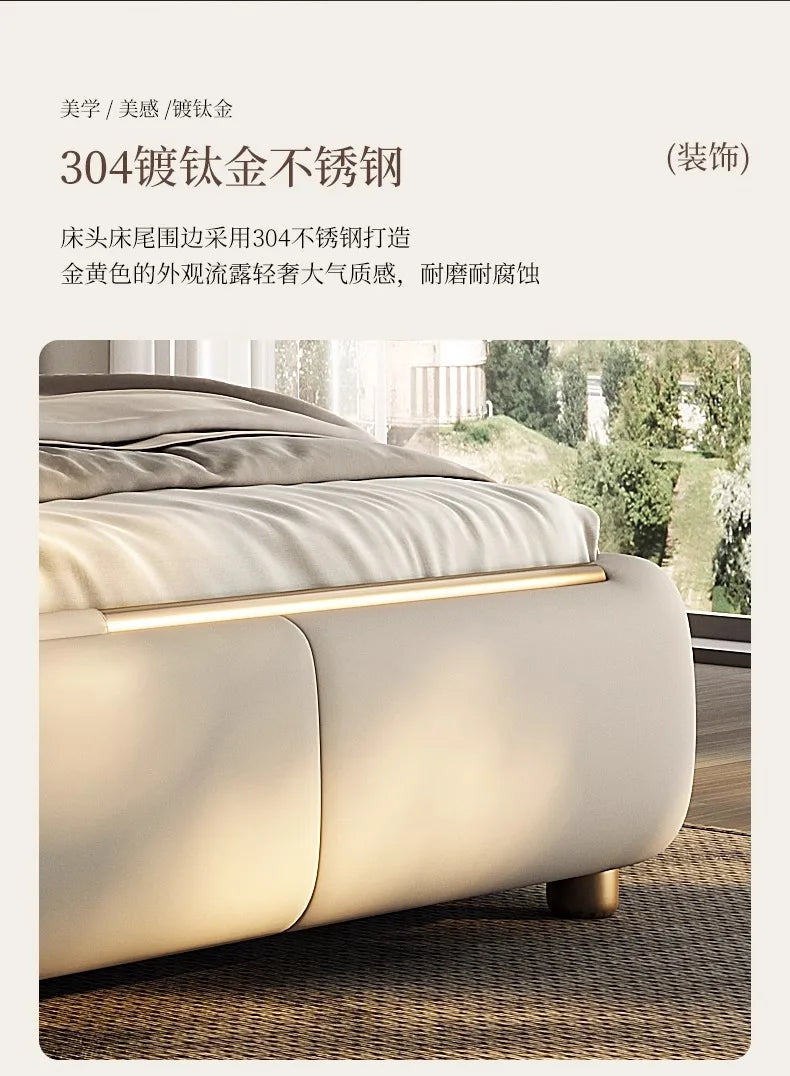 Modern double bed frame in beige with smooth, rounded edges and sleek gold-toned metallic trim detailing.