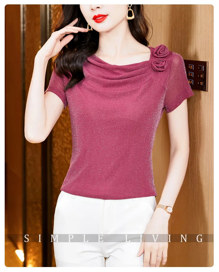 Shimmering berry-pink short-sleeve top with a cowl neckline and floral shoulder detail.