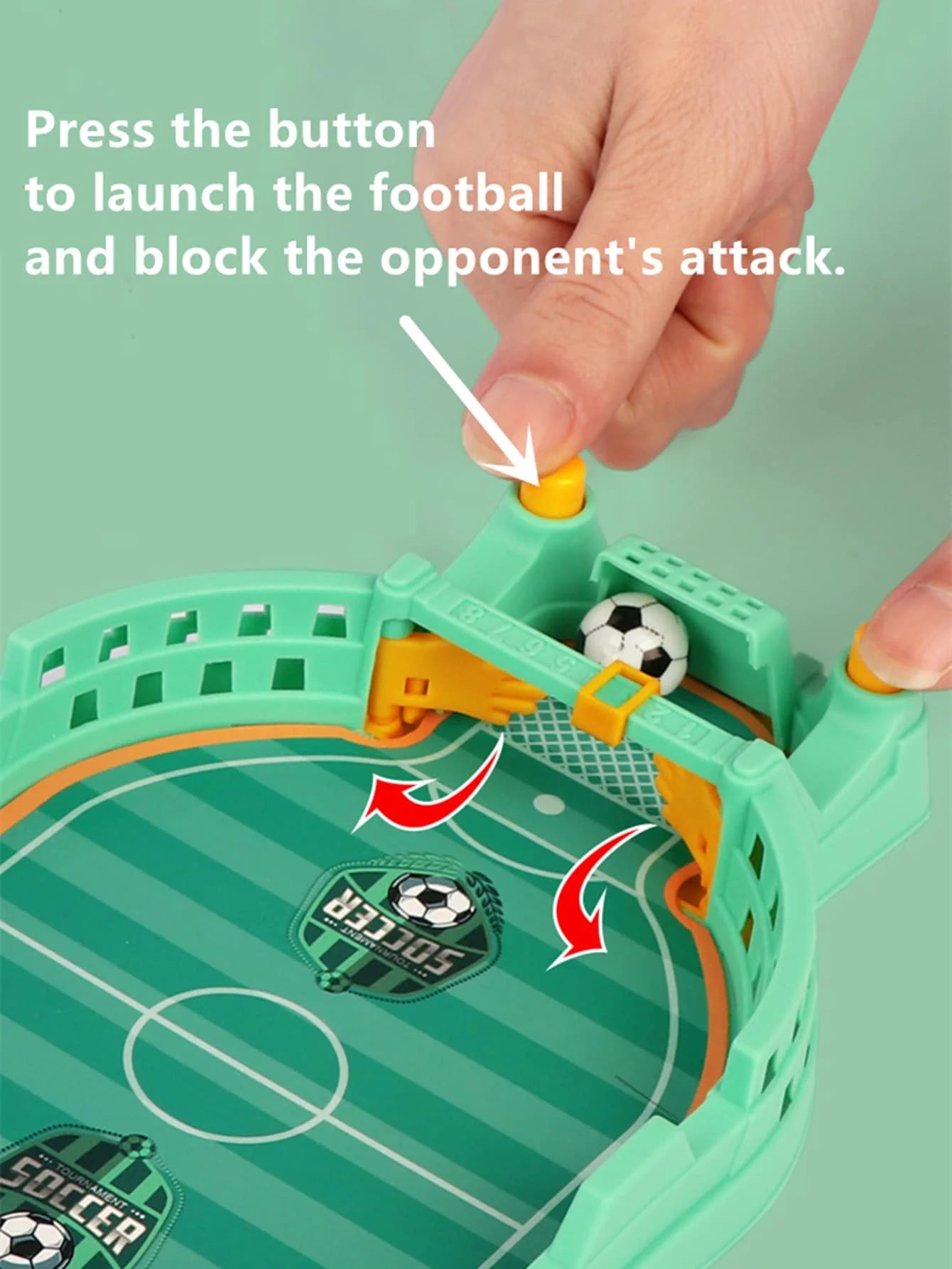 Tabletop football game in pastel green with yellow buttons, featuring a mini ball and interactive goalie action.