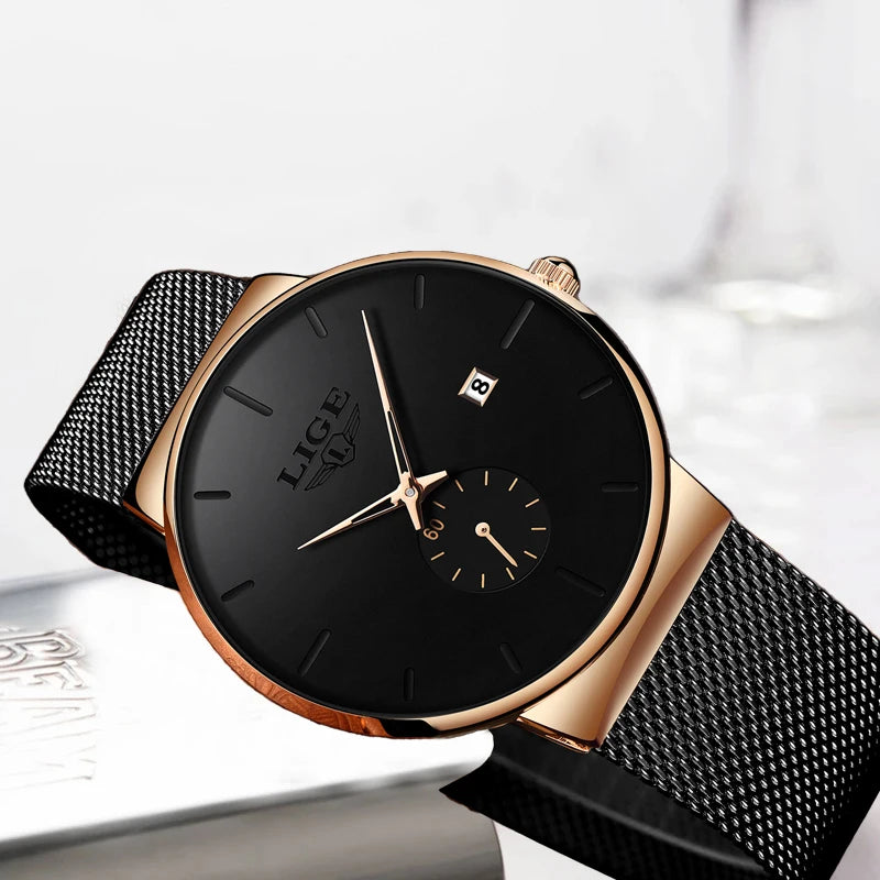 Elegant women’s quartz watch featuring a rose-gold case, black dial, date window, and a slim black mesh strap.