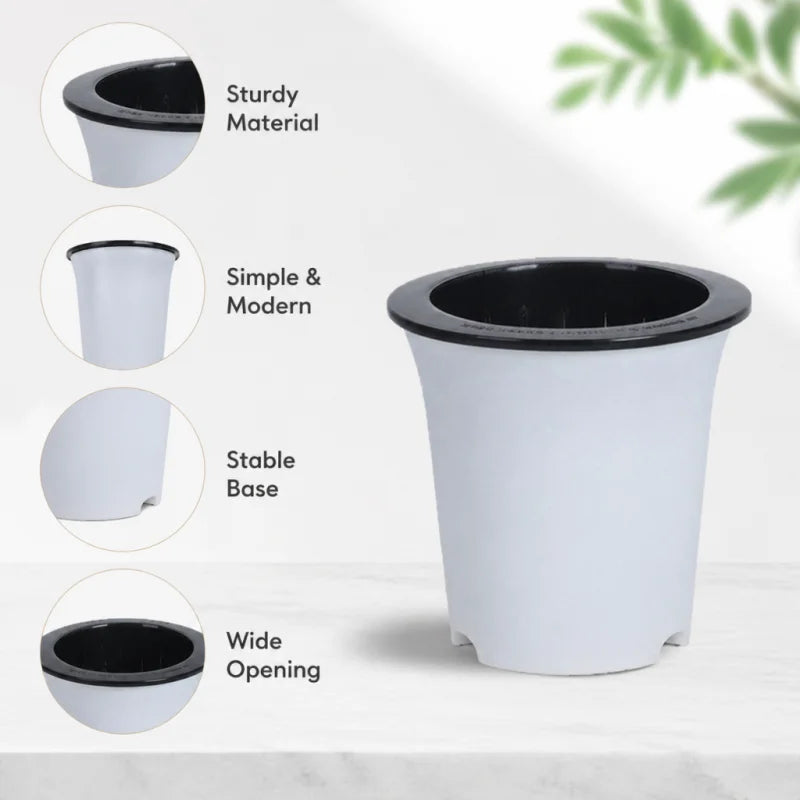 White self-watering flowerpot with a black inner basin, highlighting features like a wide opening and stable base.