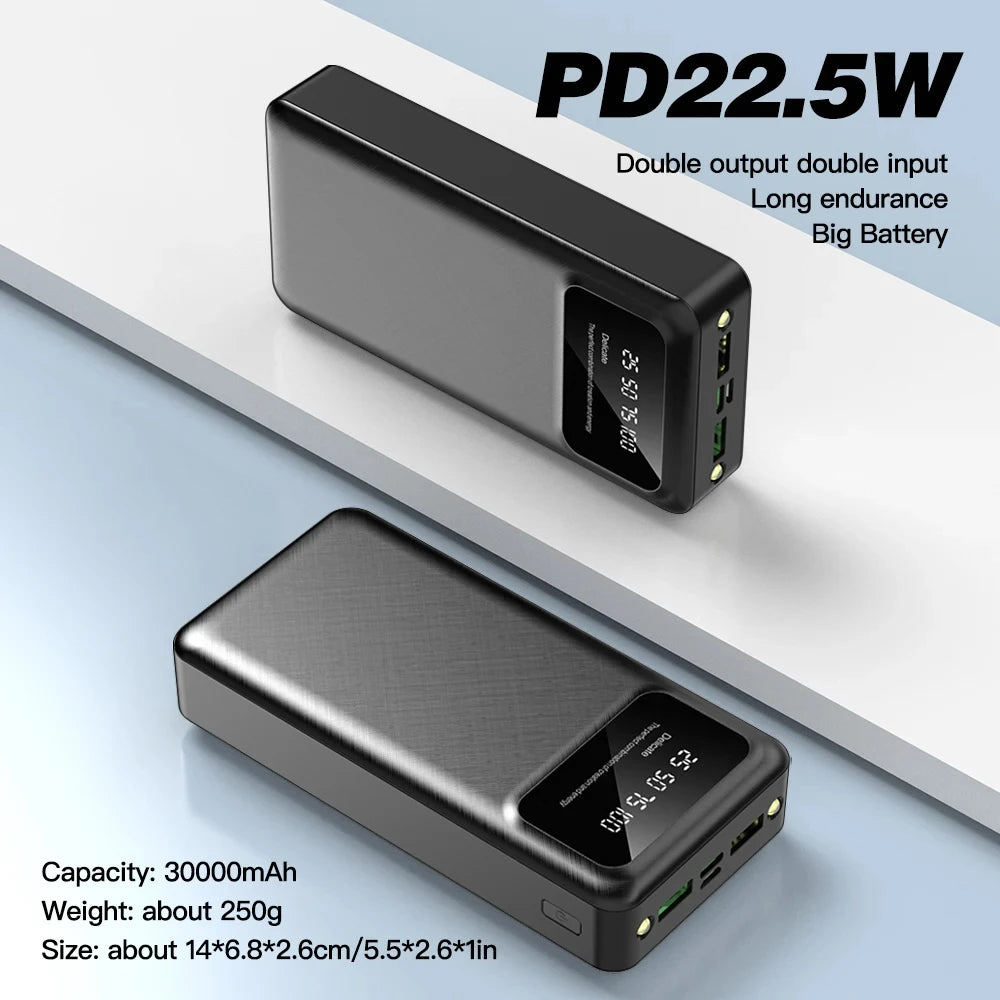 Two sleek black portable power banks with a textured finish and digital LED display showing battery percentage.