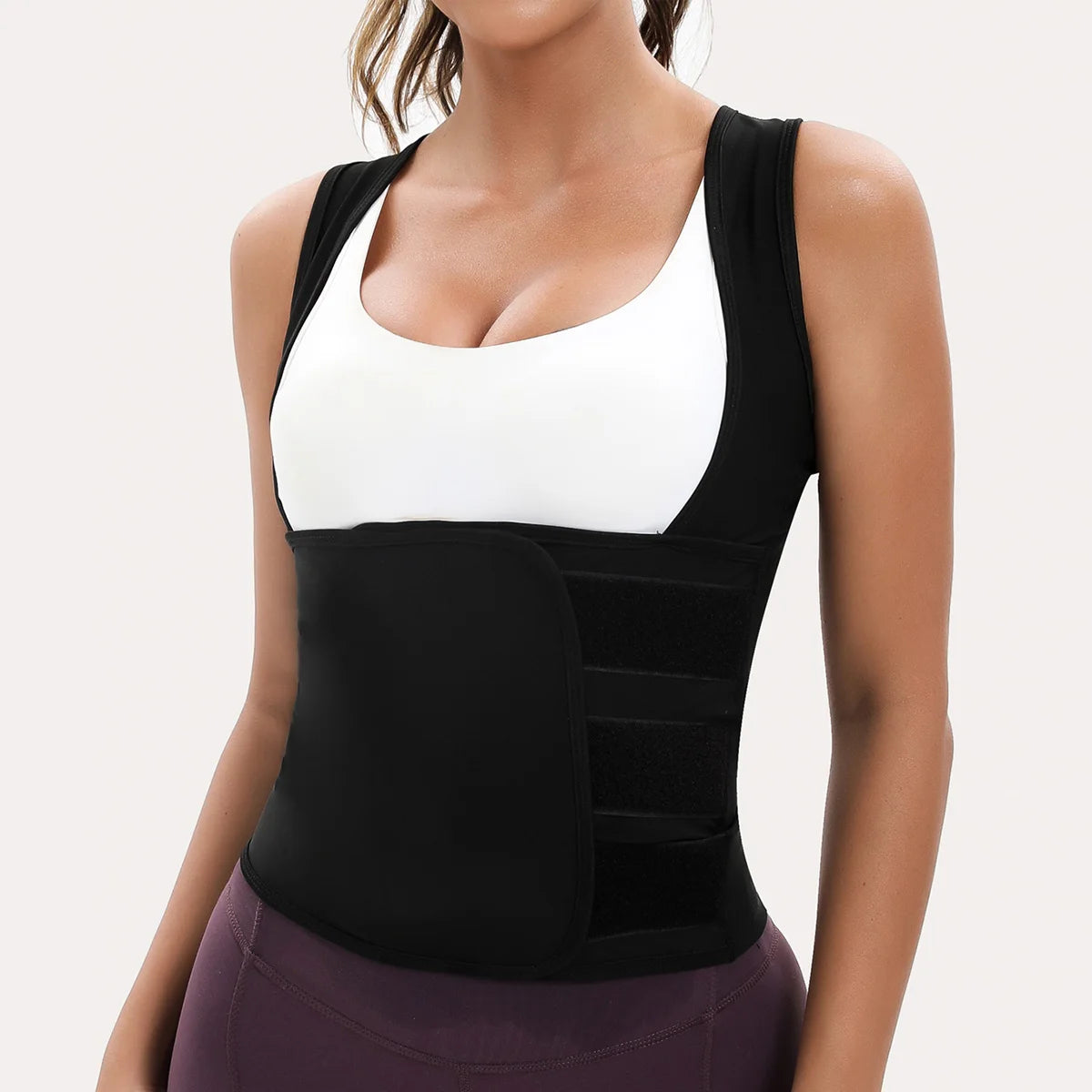 Black waist trainer vest with shoulder straps and adjustable triple-strap velcro compression belt for core support.