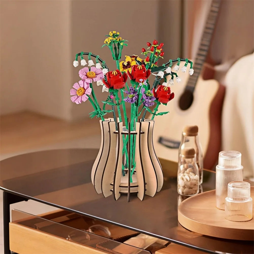 Bouquet of colourful, brick-built construction flowers in a modern, light wood-style slatted vase on a table.