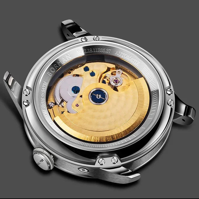 Close-up of an automatic mechanical watch case back, revealing the intricate gold-tone movement through a glass display.
