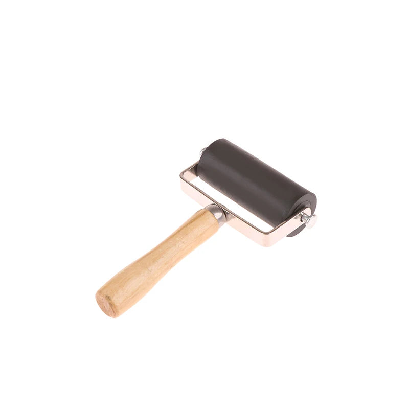 Black rubber brayer roller with a smooth wooden handle and a sturdy silver metal frame for crafting and printmaking.