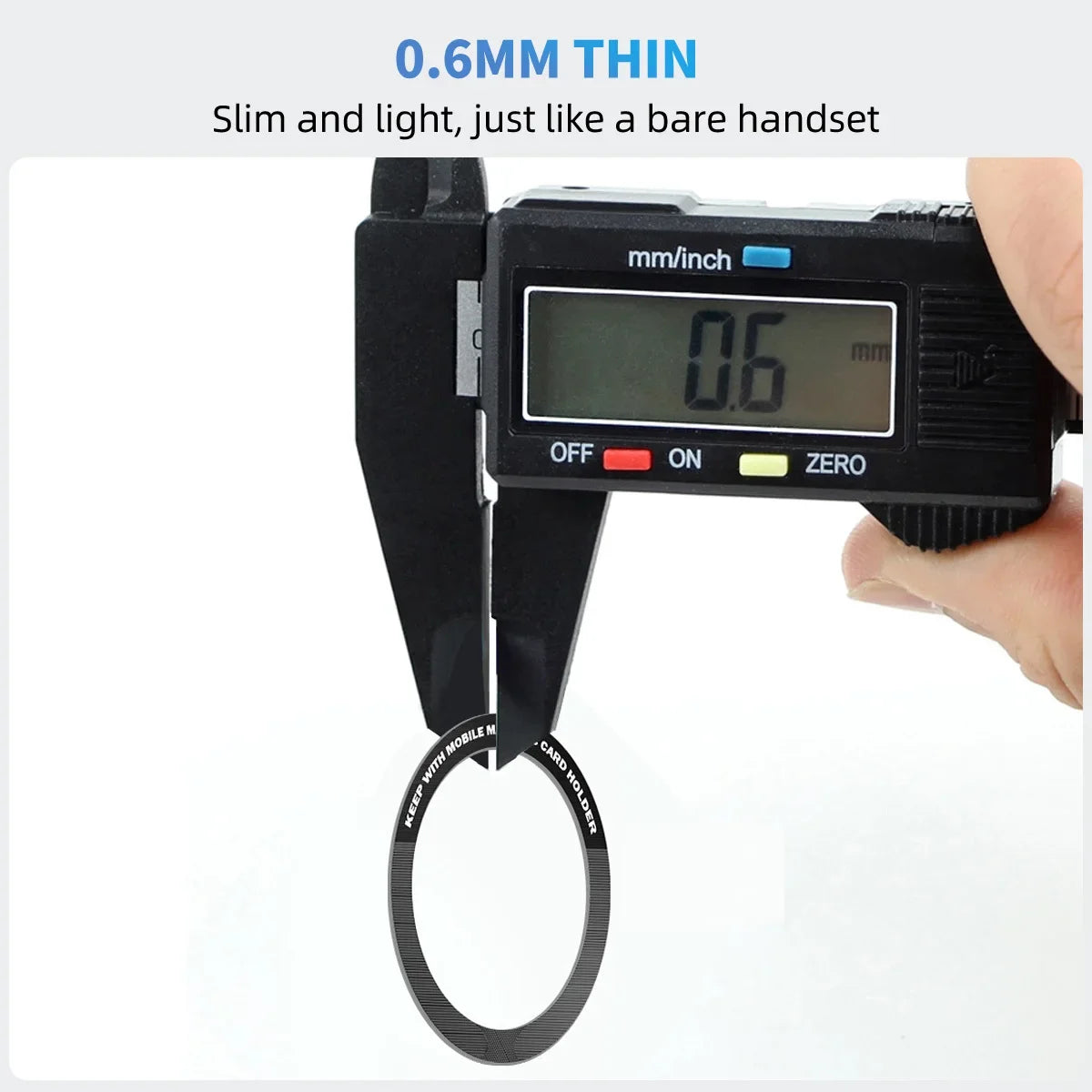 A digital caliper measures the 0.6mm thickness of a thin, black circular adhesive ring for mobile devices.