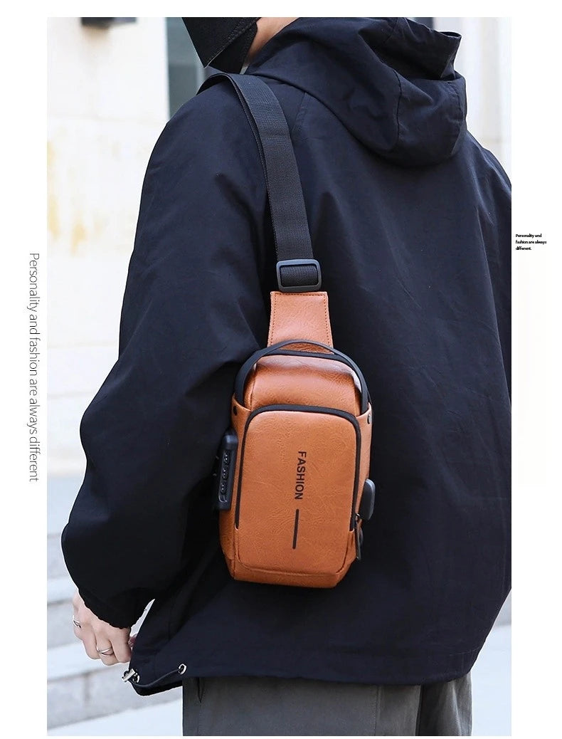 Tan leather-look anti-theft crossbody sling bag with a built-in USB port and combination lock, worn on the shoulder.