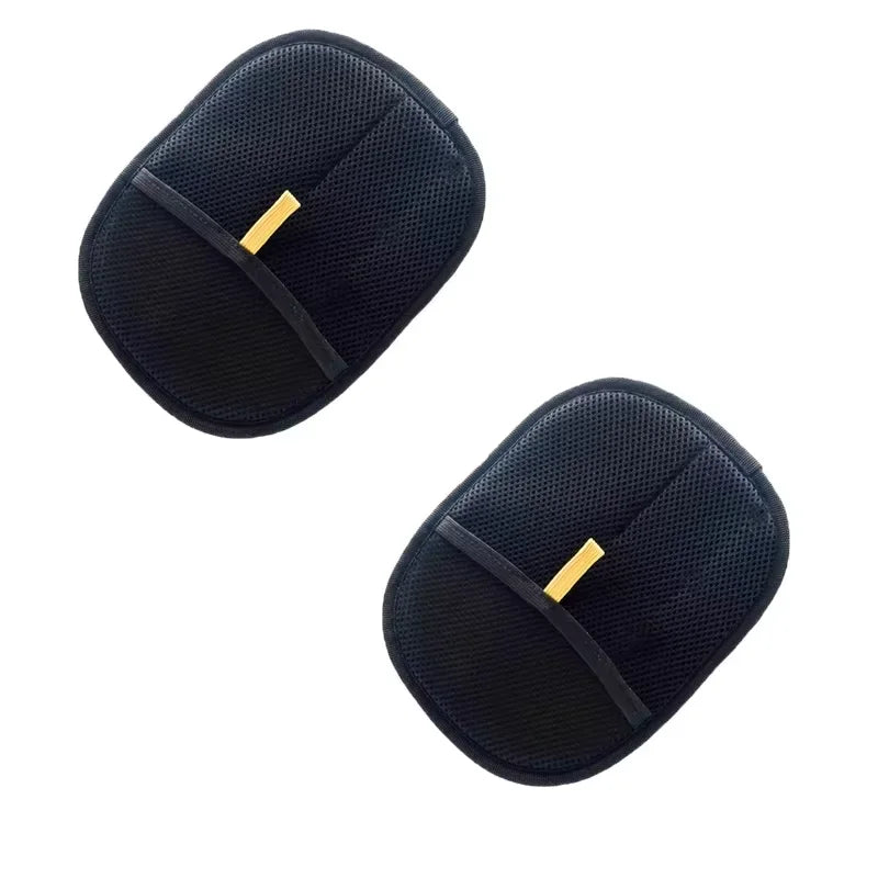 Two oval black mesh fabric pads with central yellow detail, set against a white background.