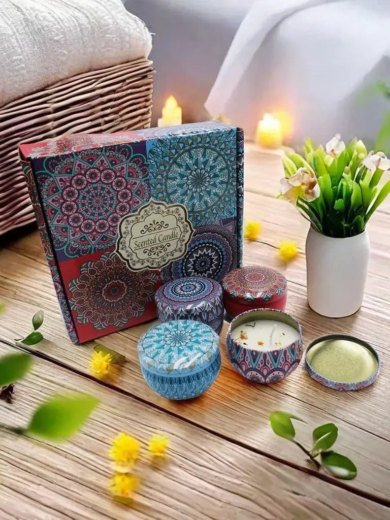 Scented candle gift set in colourful, ornate mandala-patterned tins and matching display box on a wooden surface.