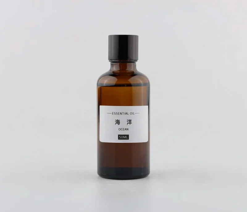 50ml amber glass essential oil bottle with a black screw cap and a label reading "Ocean" in English and Chinese.