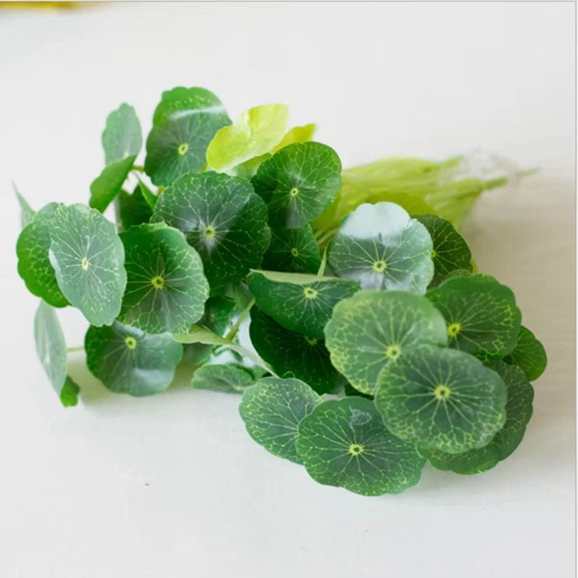 Artificial bunch of green pennywort leaves with visible veins, featuring rounded foliage on a white background.