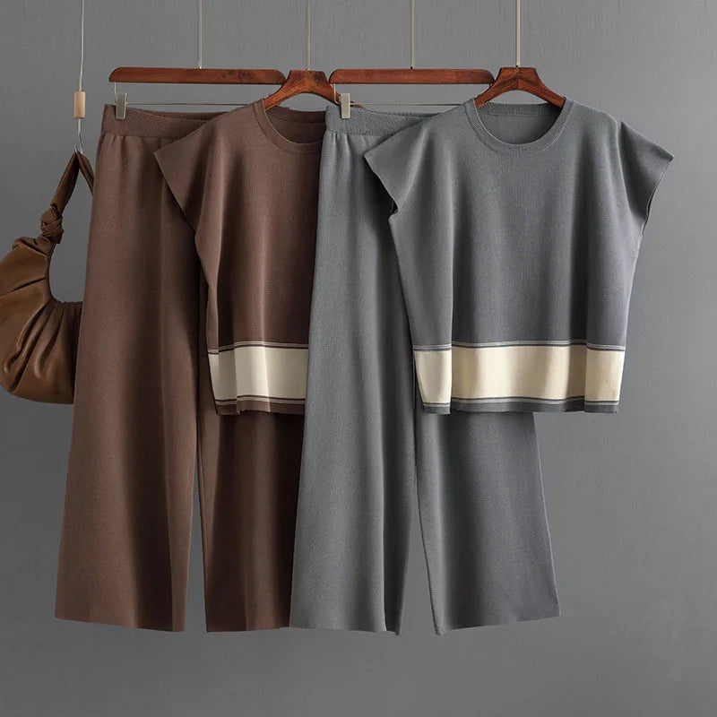 Two-piece knitted lounge sets in brown and grey, featuring wide-leg trousers and cap-sleeve tops with contrast hem detail.