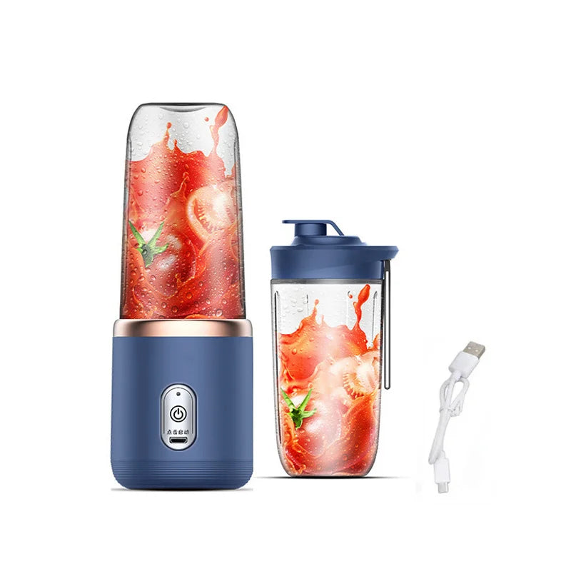 Portable navy blue personal blender with clear jars, rose gold trim, power button, and a USB charging cable.