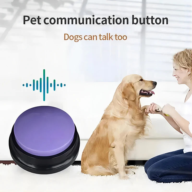 A purple, circular recordable dog training button next to a woman training her golden retriever on a white rug.