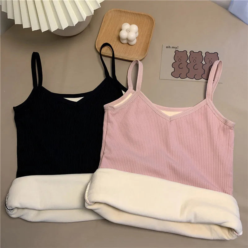 Two ribbed camisole tops in black and soft pink, featuring a v-neckline and a warm, thick fleece-lined interior.