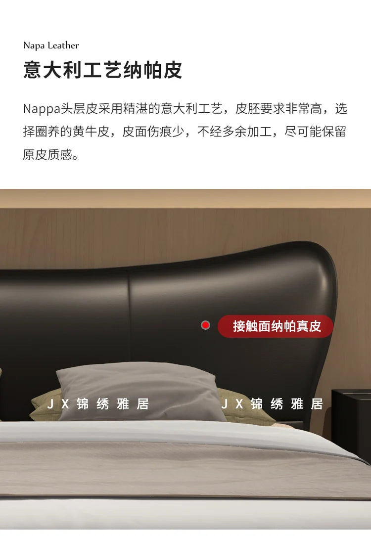 Modern black Nappa leather bed frame with a sleek, curved upholstered headboard and minimalist design.